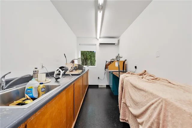 a picture of a utility room with dryer and washer