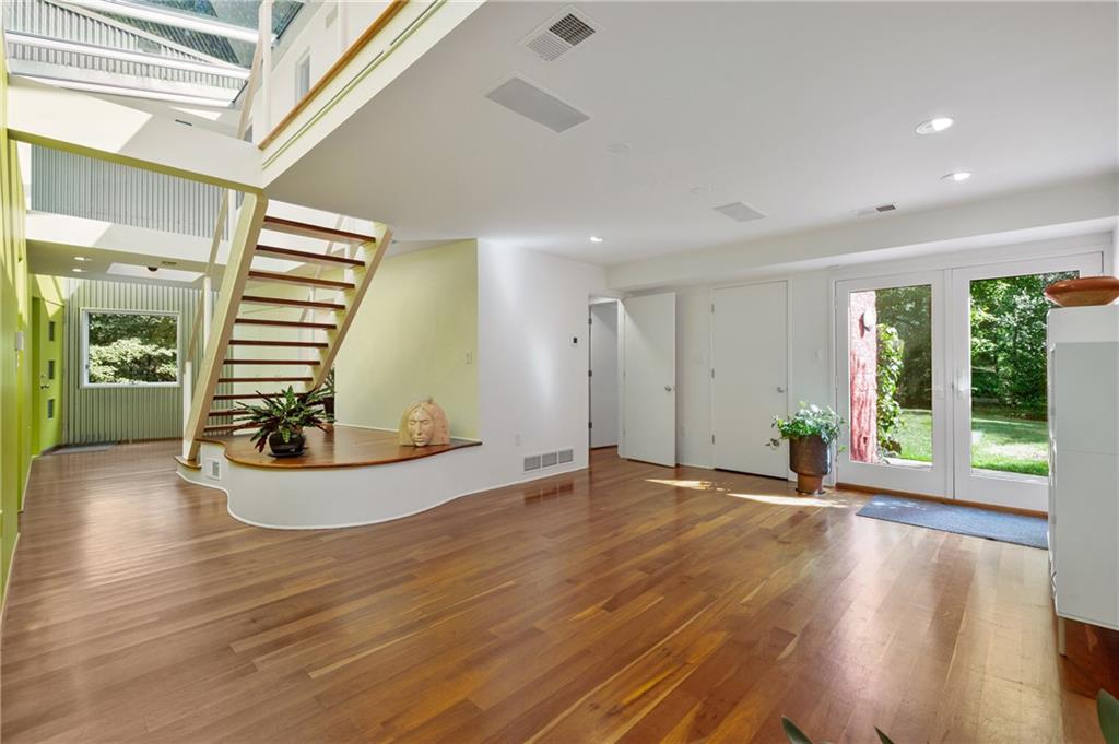 121 Hidden Ridge Pittsburgh, PA 15238 - Photo 5 of 48 a view of an empty room with wooden floor and a window