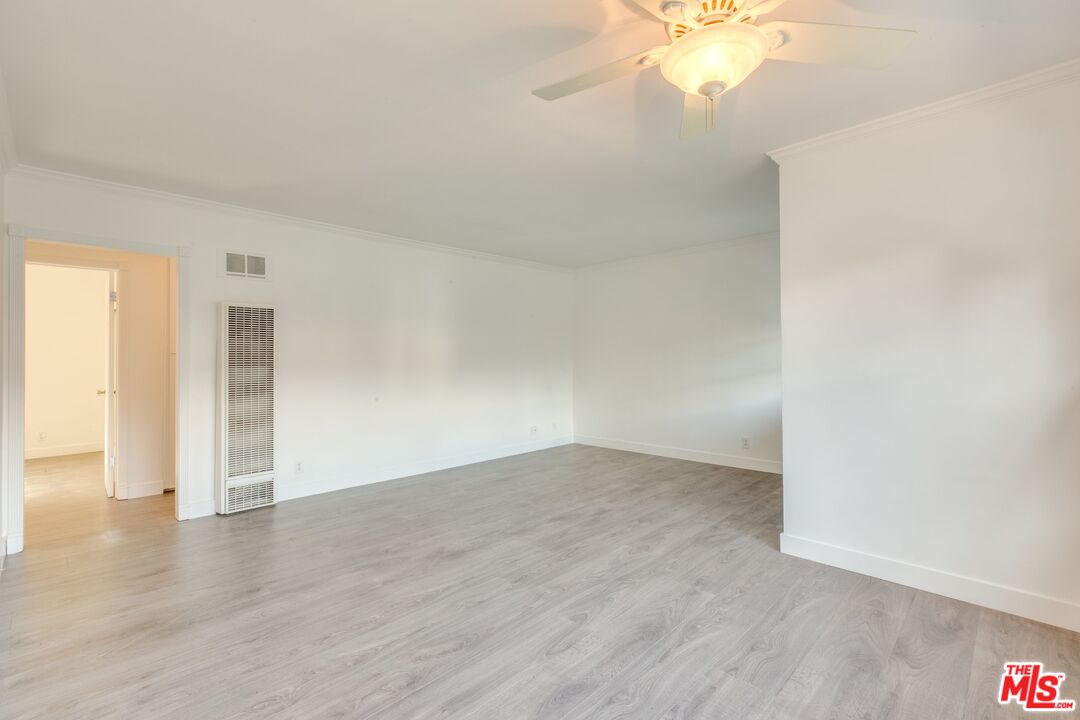 4179 Ince Boulevard, Unit 1/2 Culver City, CA 90232 - Photo 5 of 15 an empty room with wooden floor and windows