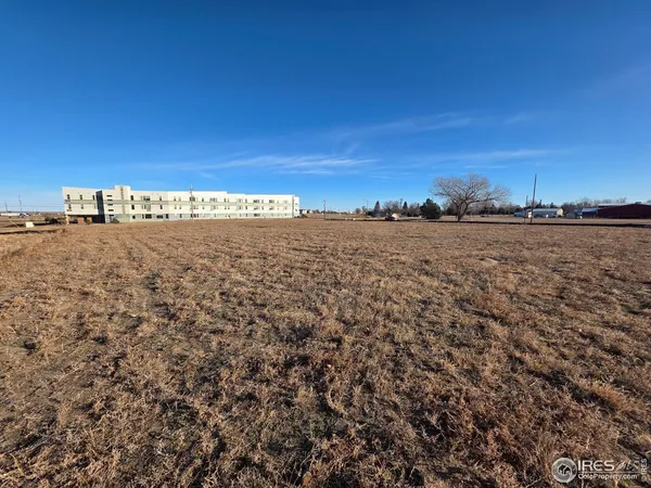 a view of a large building with beach