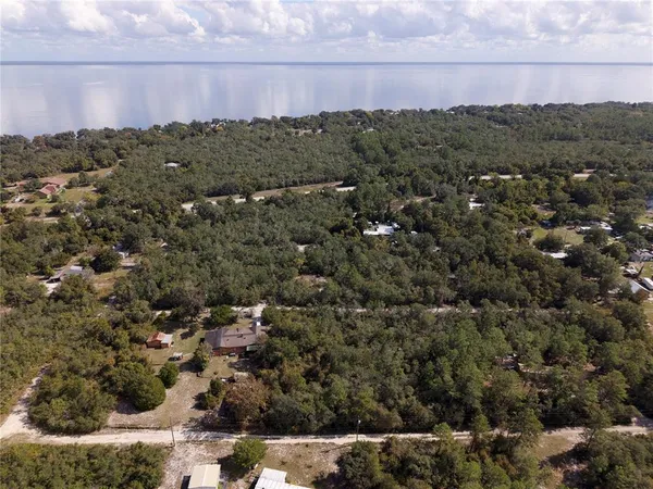 a view of a city with green field