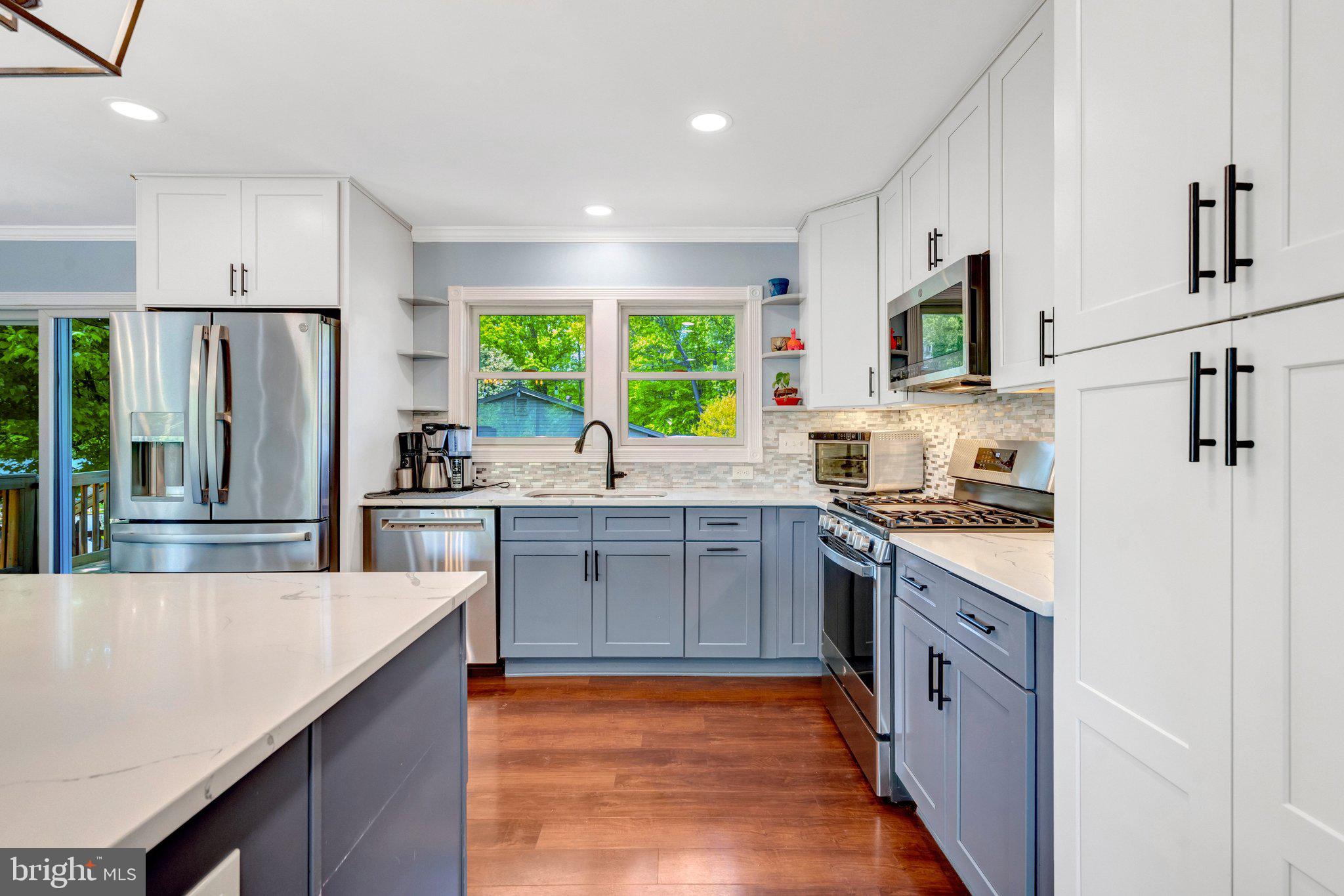 7212 Galgate Drive Springfield, VA 22153 - Photo 11 of 39 a large kitchen with stainless steel appliances granite countertop a stove a sink dishwasher and a refrigerator