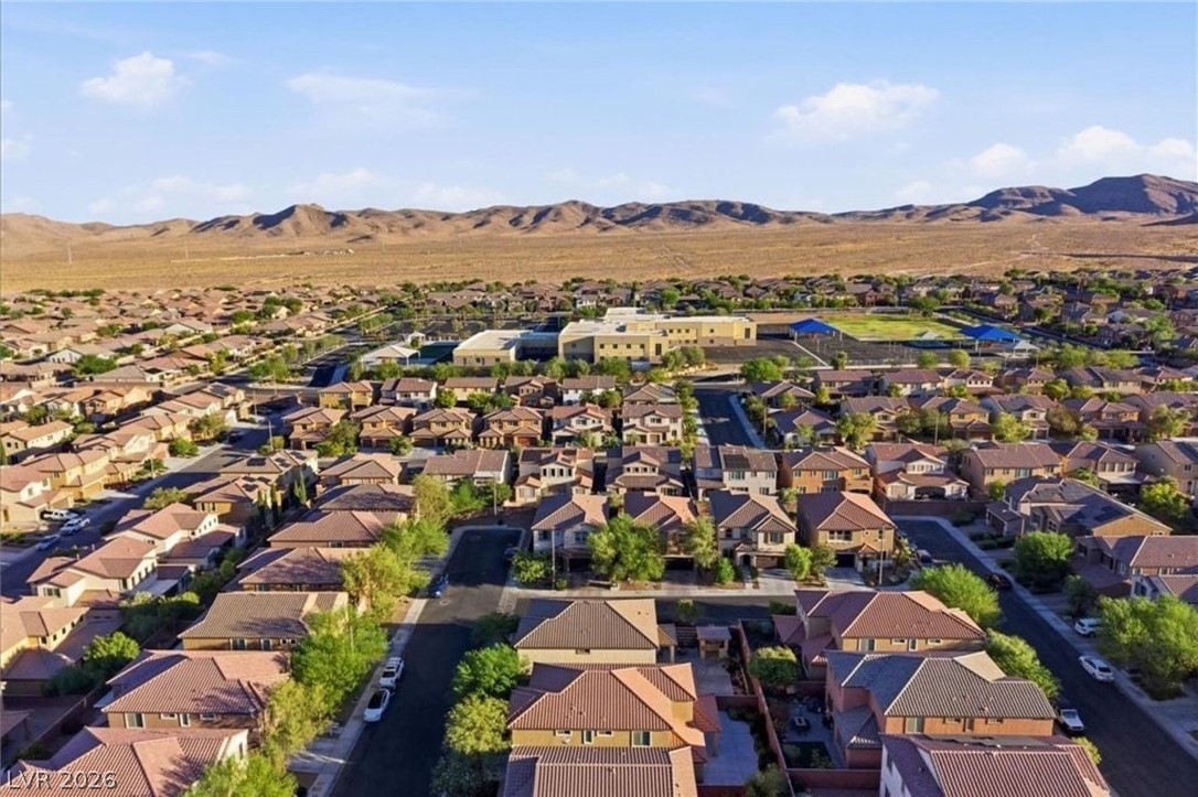 11009 Prairie Grove Road Las Vegas, NV 89179 - Photo 47 of 49 An aerial perspective reveals a well-planned desert community featuring residential homes and community facilities.