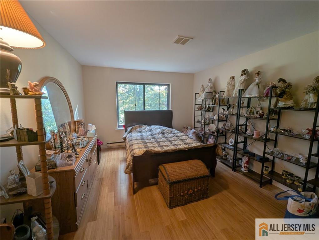 277 Cross Drive, Unit 2E Monroe Township, NJ 08831 - Photo 10 of 10 a view of a livingroom with furniture and window