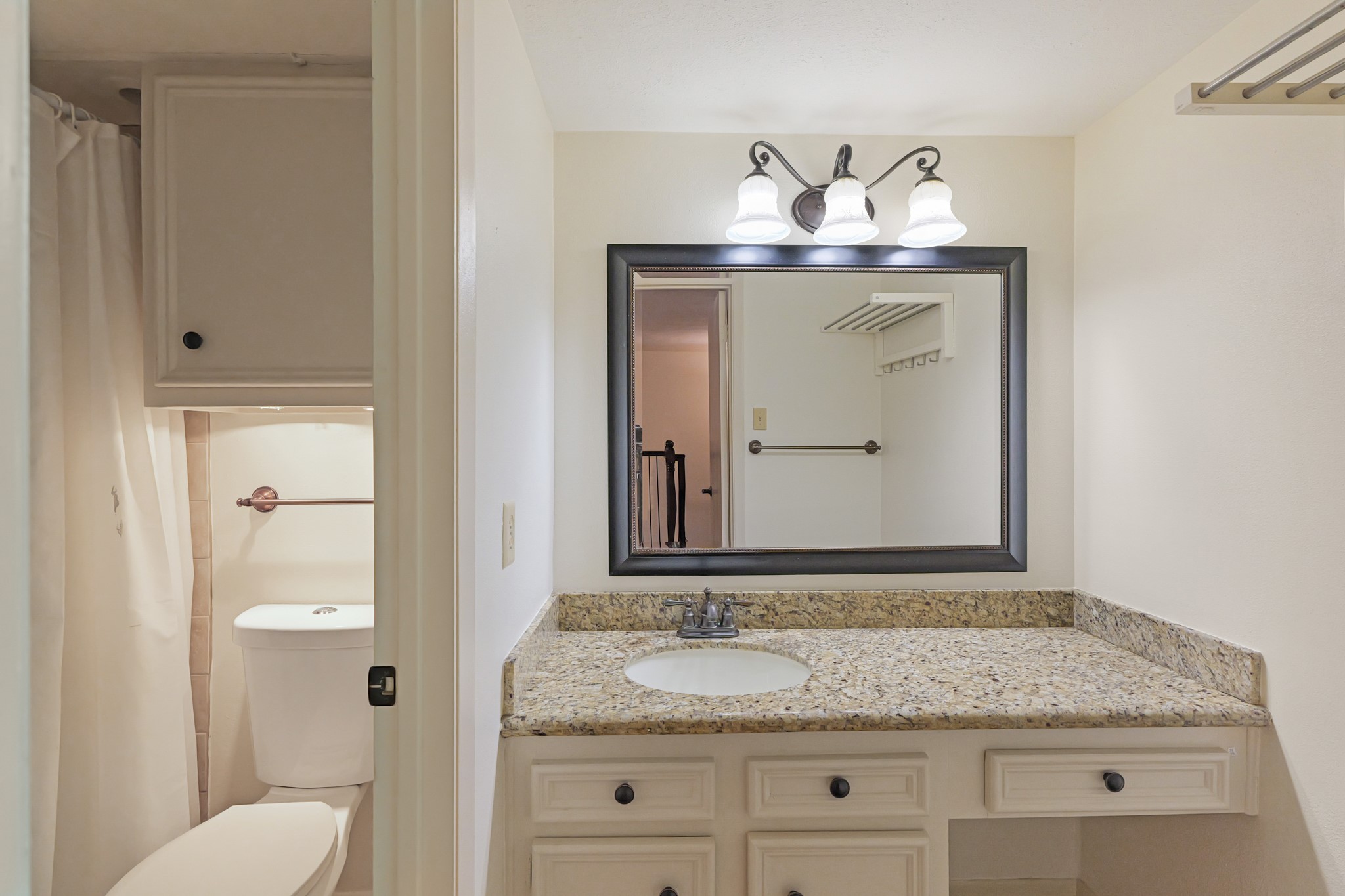 2800 Jeanetta Street, Unit 1402 Houston, TX 77063 - Photo 17 of 29 a bathroom with a granite countertop sink and a mirror