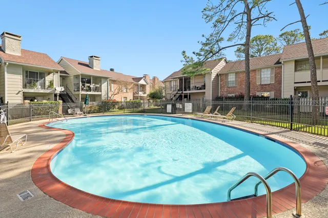 a view of a house with swimming pool