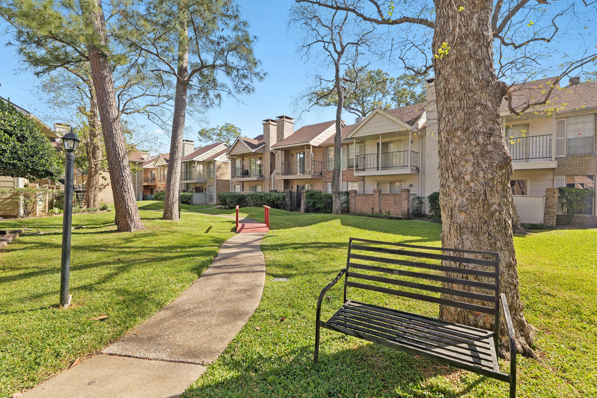 2800 Jeanetta Street, Unit 1402 Houston, TX 77063 - Photo 26 of 29 a front view of a house with a yard table and chairs