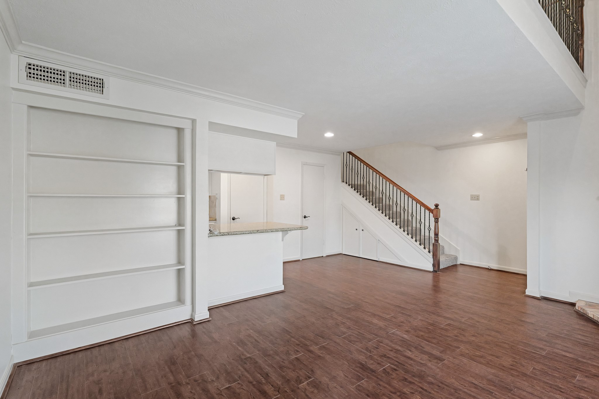 2800 Jeanetta Street, Unit 1402 Houston, TX 77063 - Photo 8 of 29 a view of an empty room with wooden floor