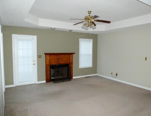 349 Sango Road Clarksville, TN 37043 - Photo 5 of 20 Large Great Room with Tray Ceiling, Ceiling Fan, Fireplace with Gas Logs