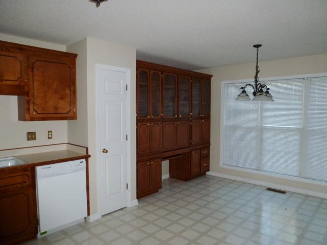 349 Sango Road Clarksville, TN 37043 - Photo 7 of 20 Another View of Kitchen with Pantry and Additional Cabinetry and Built in Computer Desk