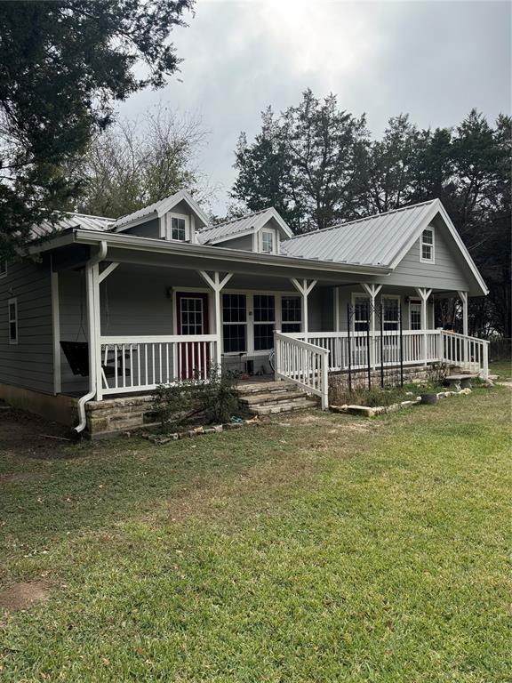 14283 Gholson Road Waco, TX 76705 - Photo 3 of 5 a front view of a house with a garden
