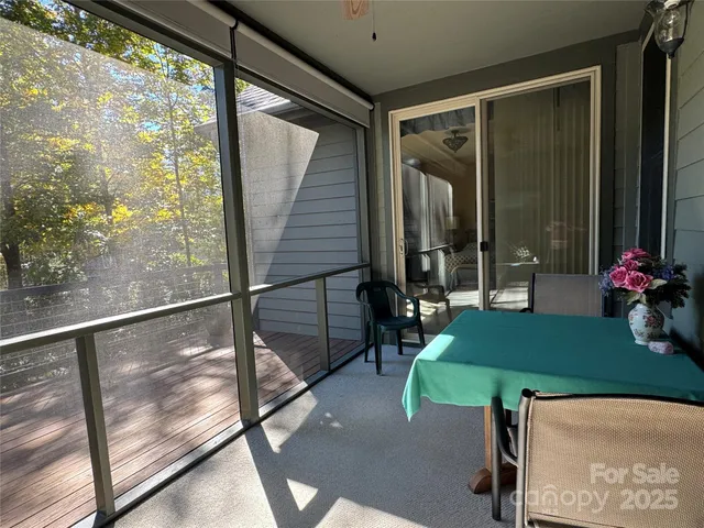 a view of a balcony with wooden floor
