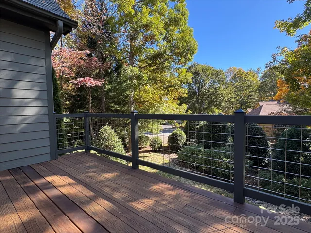 a view of a balcony with a tree