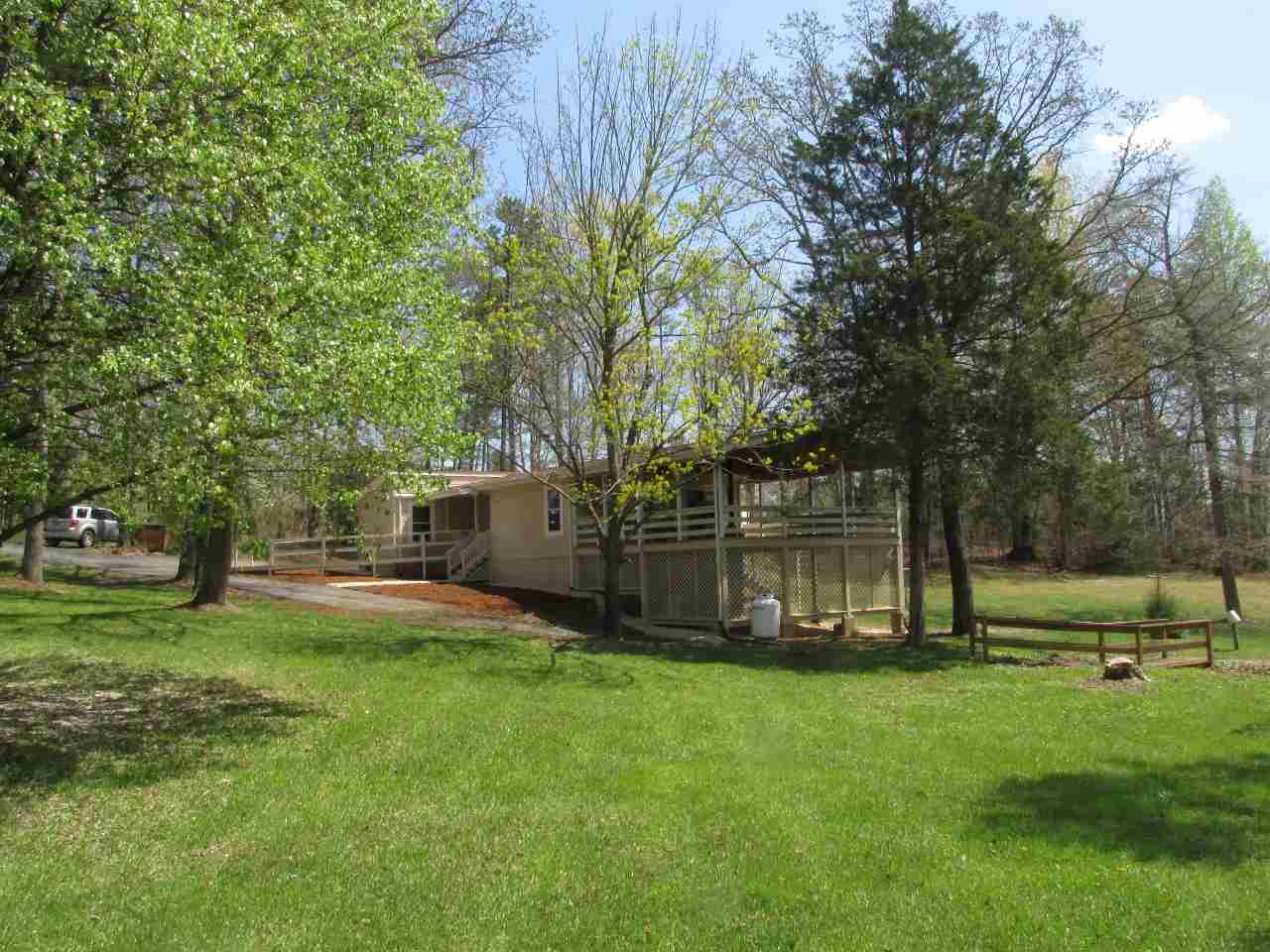 694 Matthew Mill Road Ruckersville, VA 22968 - Photo 3 of 17 a view of a backyard with large trees