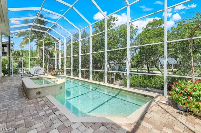 a view of a swimming pool with a lounge chair