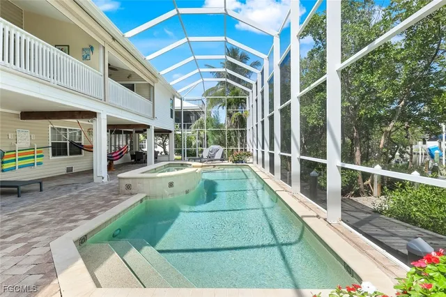 a view of swimming pool with a lounge chair