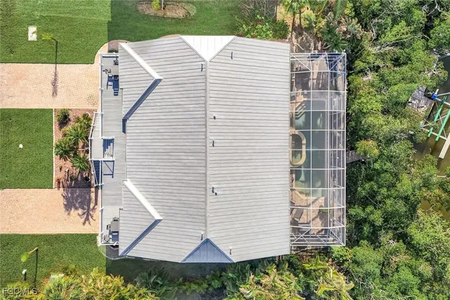 a view of a backyard with sitting area