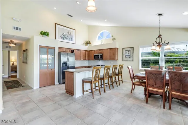 a dining room with furniture and window