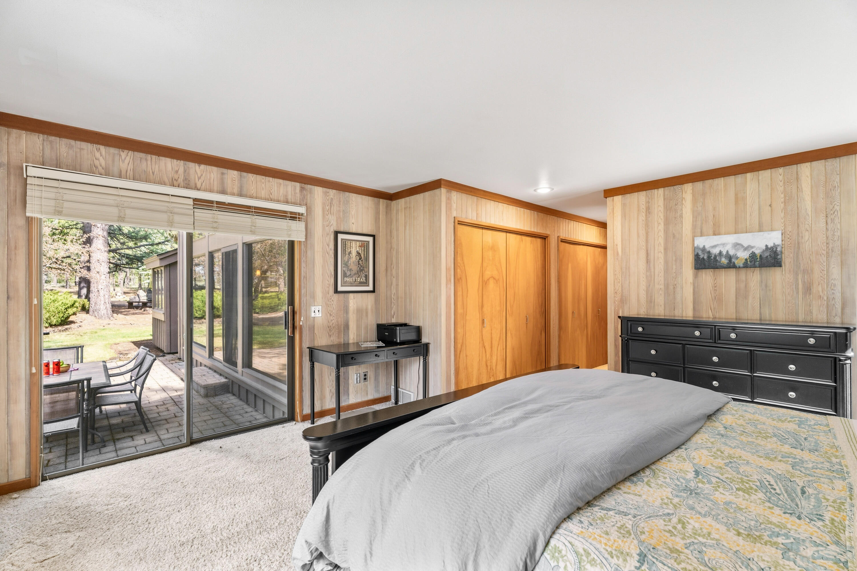 17866 Grouse Lane, Unit 3 Sunriver, OR 97707 - Photo 35 of 61 a bedroom with a bed and wooden floor