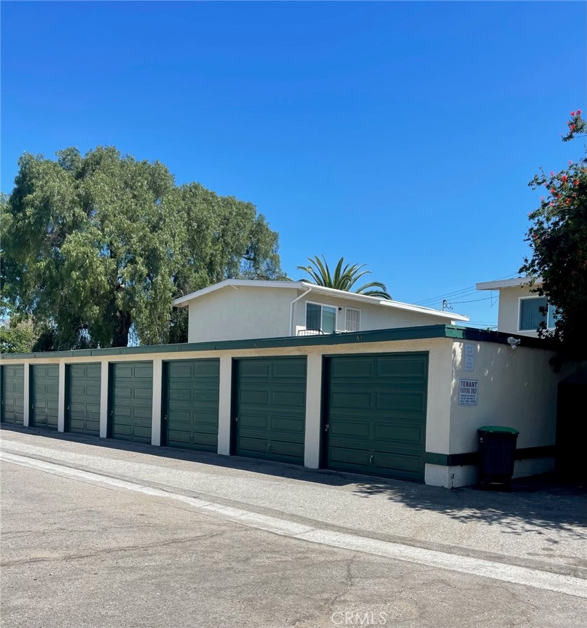 2447 Elden Avenue, Unit C2 Costa Mesa, CA 92627 - Photo 10 of 10 a front view of a house with a yard and garage