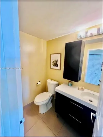 a room with a bed and a flat screen tv