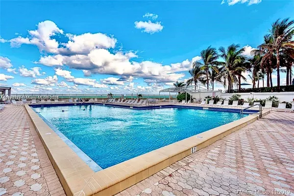 a view of swimming pool with a yard