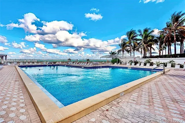 a view of swimming pool with a yard