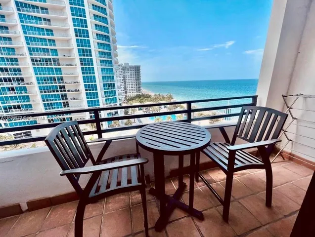 a view of a chairs and table on the terrace