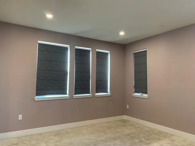 a bathroom with a toilet sink vanity and mirror
