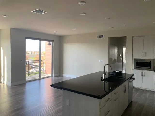 a kitchen with a sink and cabinets