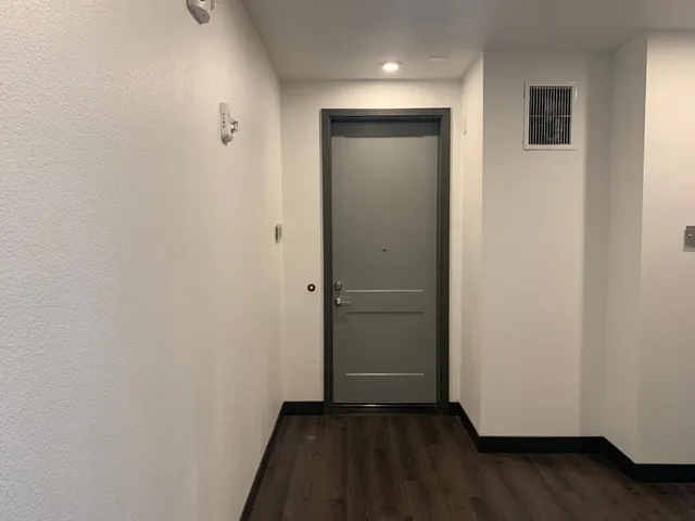 a living room with a table and a fireplace