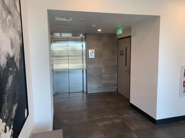 a view of a building with sitting area