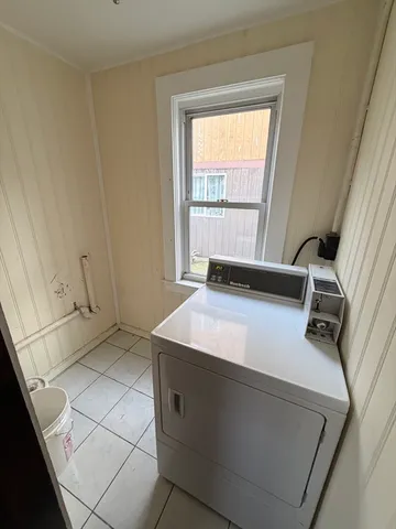 a room with a bed and a window