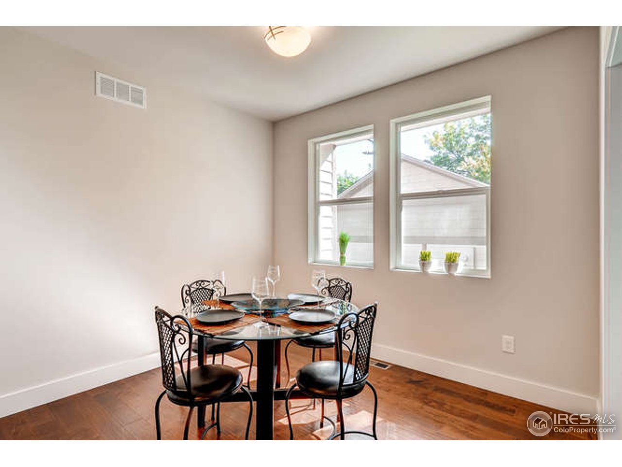 812 East Baseline Road, Unit B Lafayette, CO 80026 - Photo 2 of 9 a view of a dining room with furniture and window