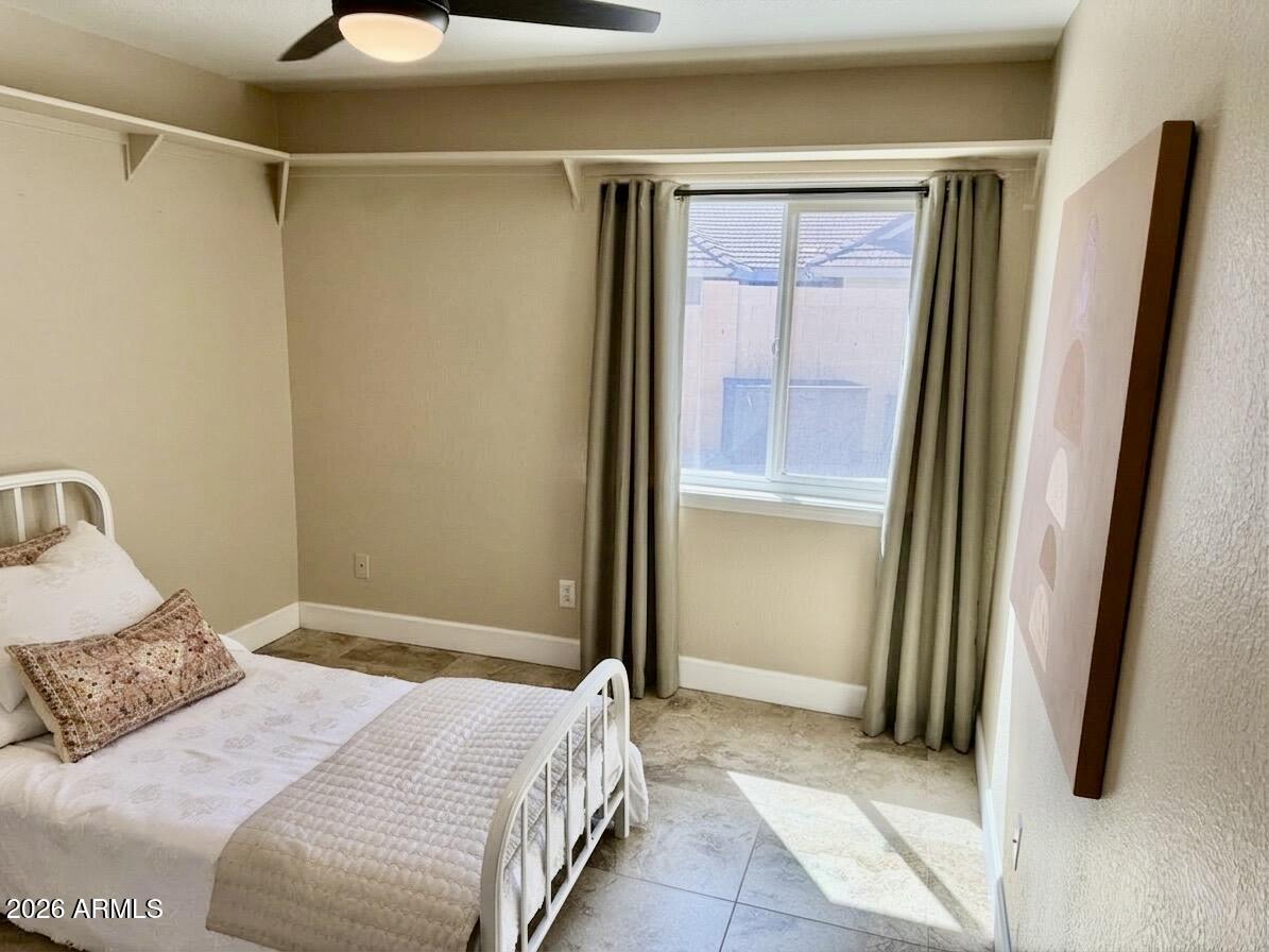 401 East Merrill Avenue Gilbert, AZ 85234 - Photo 11 of 21 a bedroom with a bed and a mirror