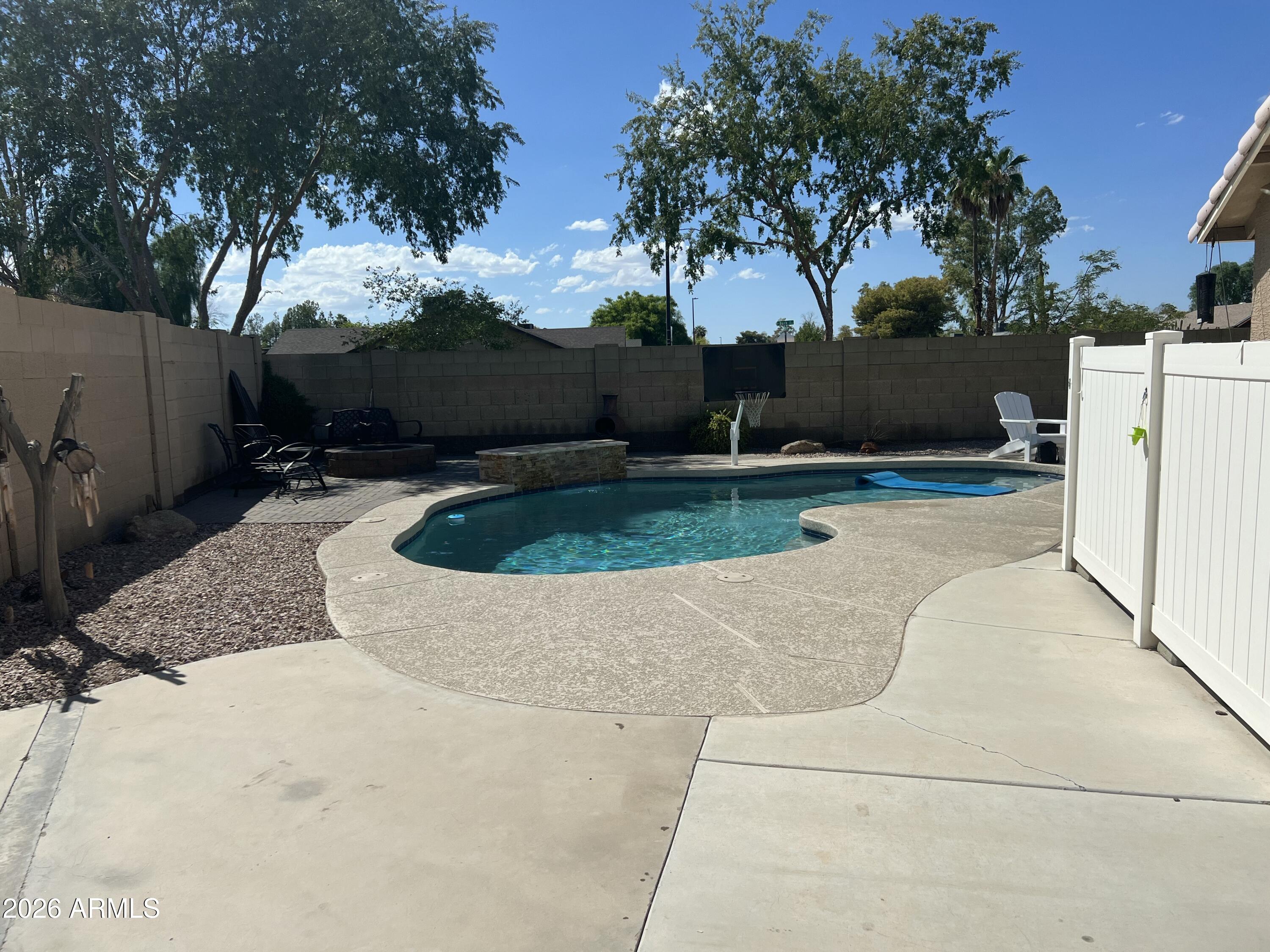 401 East Merrill Avenue Gilbert, AZ 85234 - Photo 17 of 21 a view of backyard with swimming pool
