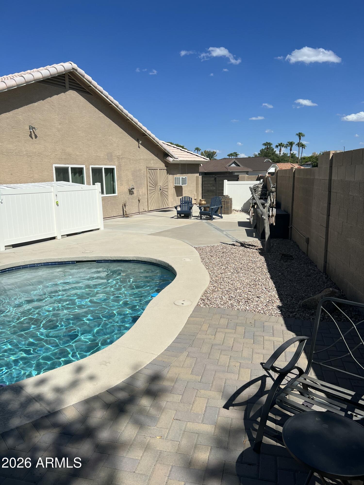 401 East Merrill Avenue Gilbert, AZ 85234 - Photo 18 of 21 a front view of a house with garden