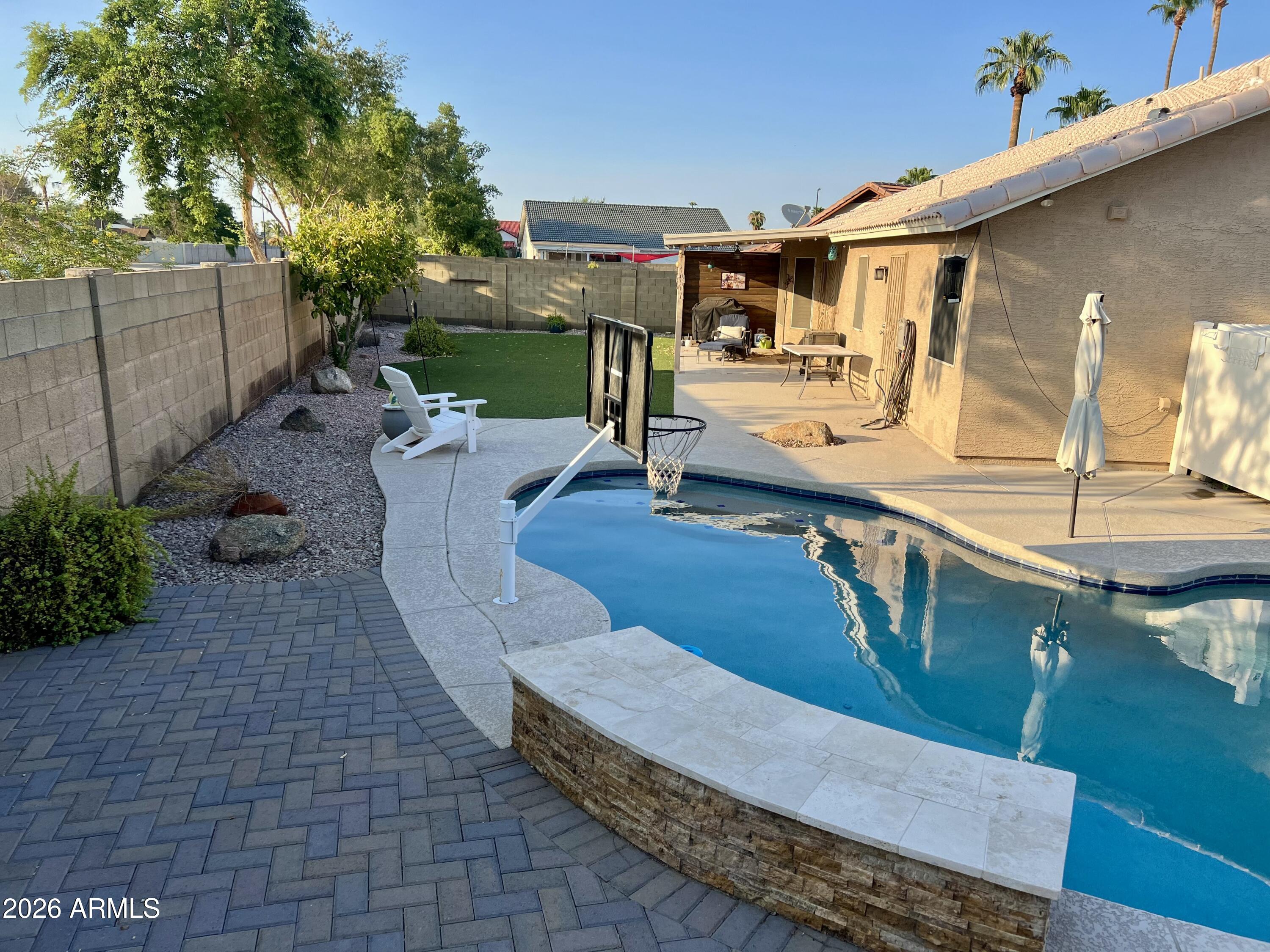 401 East Merrill Avenue Gilbert, AZ 85234 - Photo 19 of 21 a view of a patio with couches table and chairs with potted plants