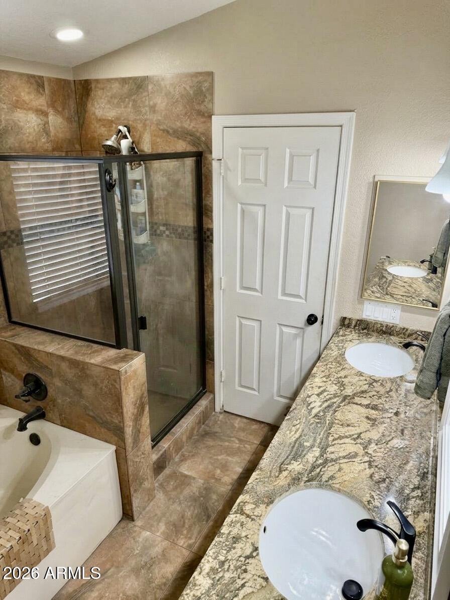 401 East Merrill Avenue Gilbert, AZ 85234 - Photo 9 of 21 a bathroom with a tub sink and shower