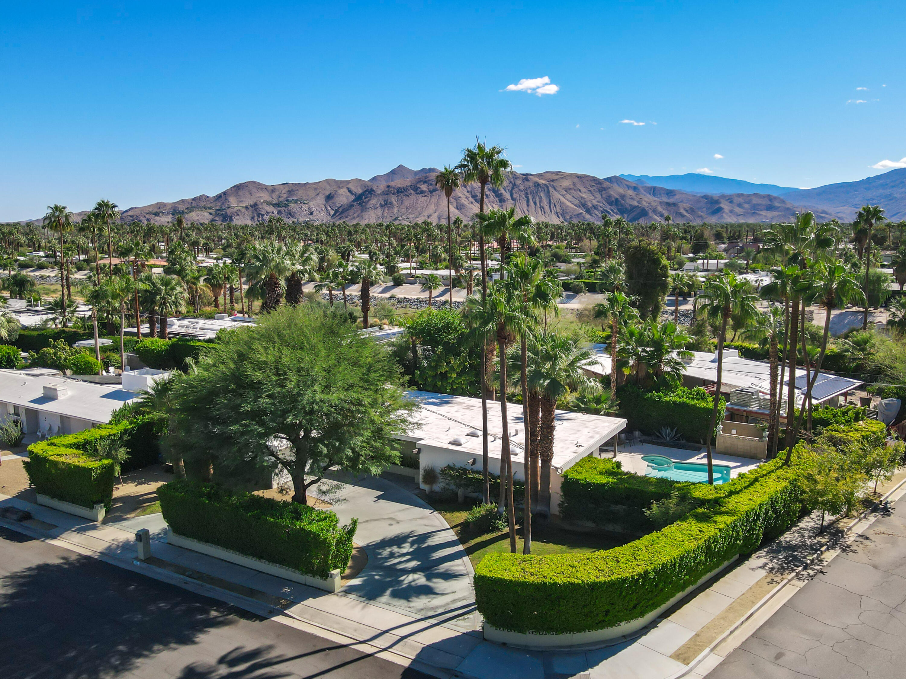 823 San Lucas Road Palm Springs, CA 92264 - Photo 1 of 71 a view of a house with a yard and outdoor seating