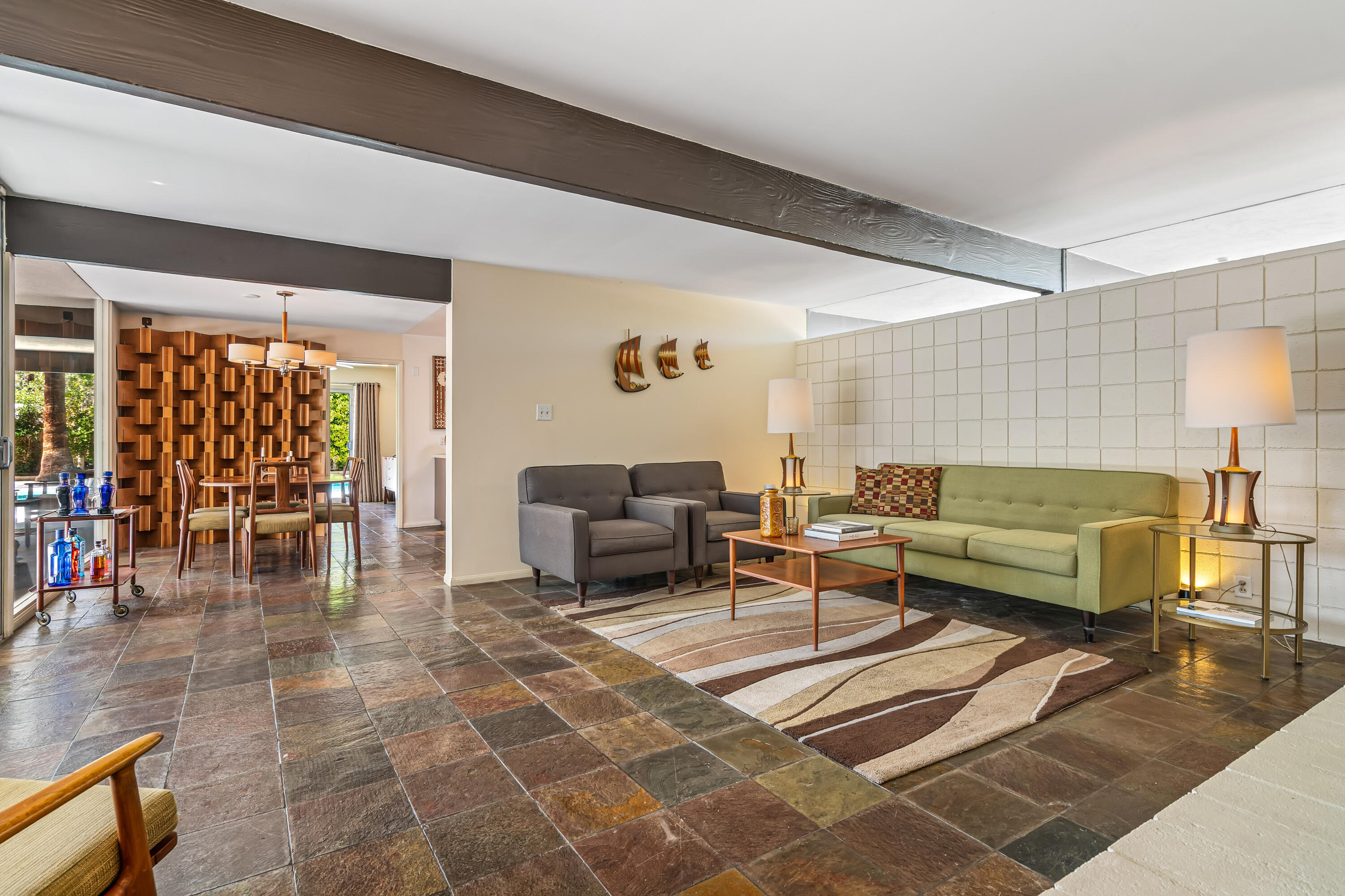 823 San Lucas Road Palm Springs, CA 92264 - Photo 12 of 71 a living room with furniture and a table