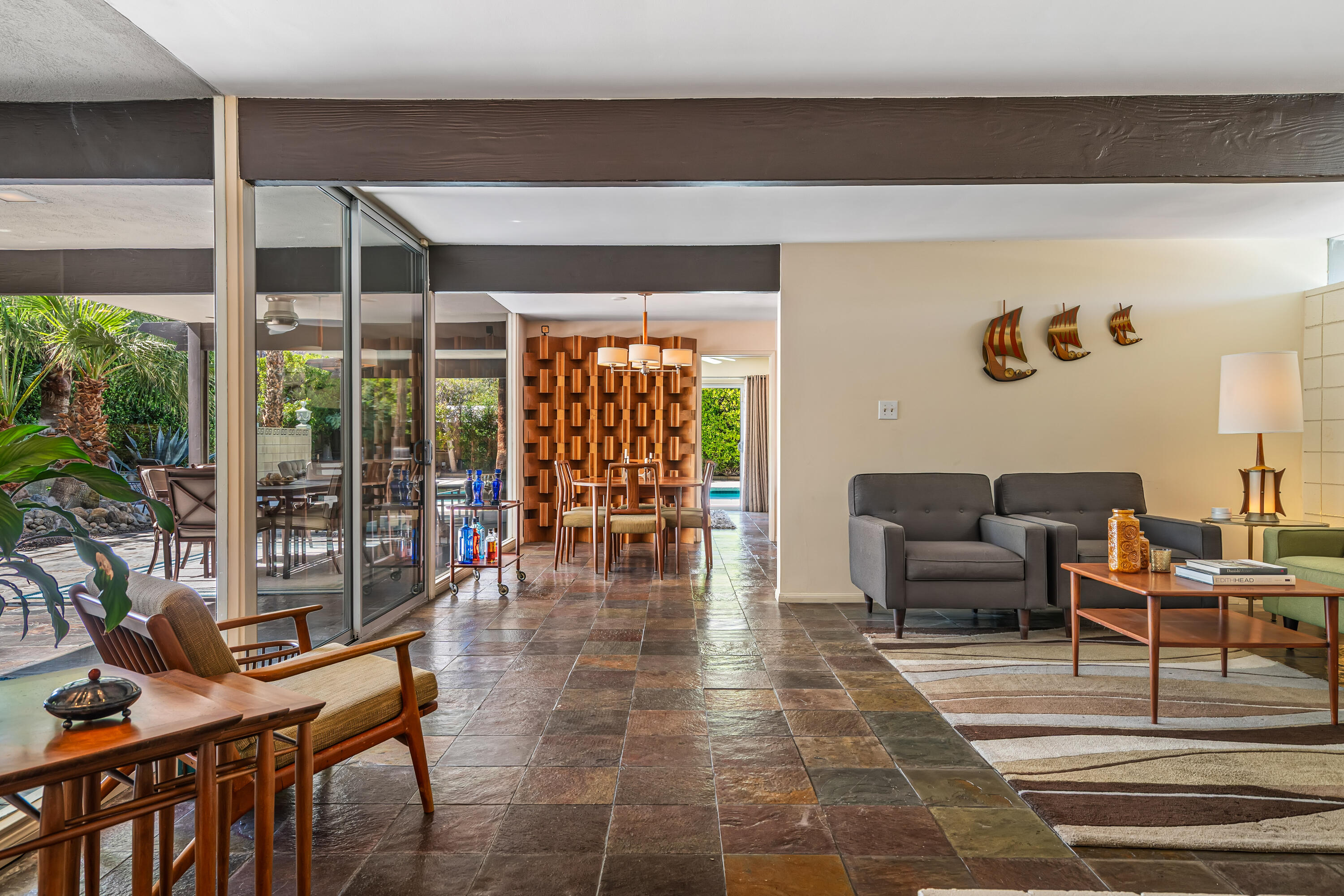 823 San Lucas Road Palm Springs, CA 92264 - Photo 13 of 71 a living room with furniture a rug and a large window
