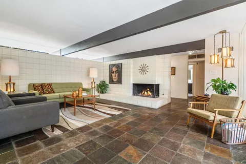 a view of a dining room with furniture window and outside view