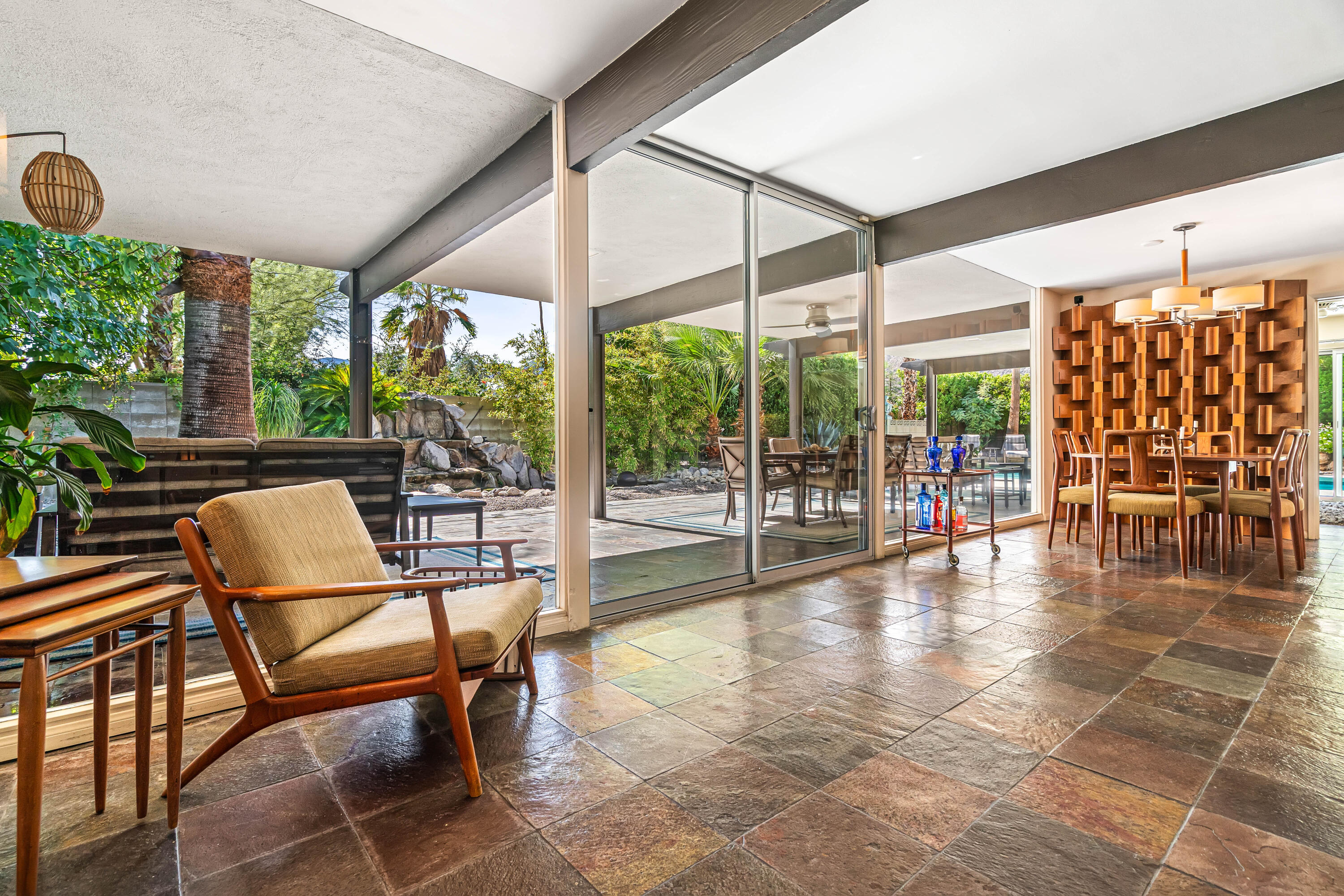 823 San Lucas Road Palm Springs, CA 92264 - Photo 17 of 71 a view of a dining room with furniture wooden floor and garden view