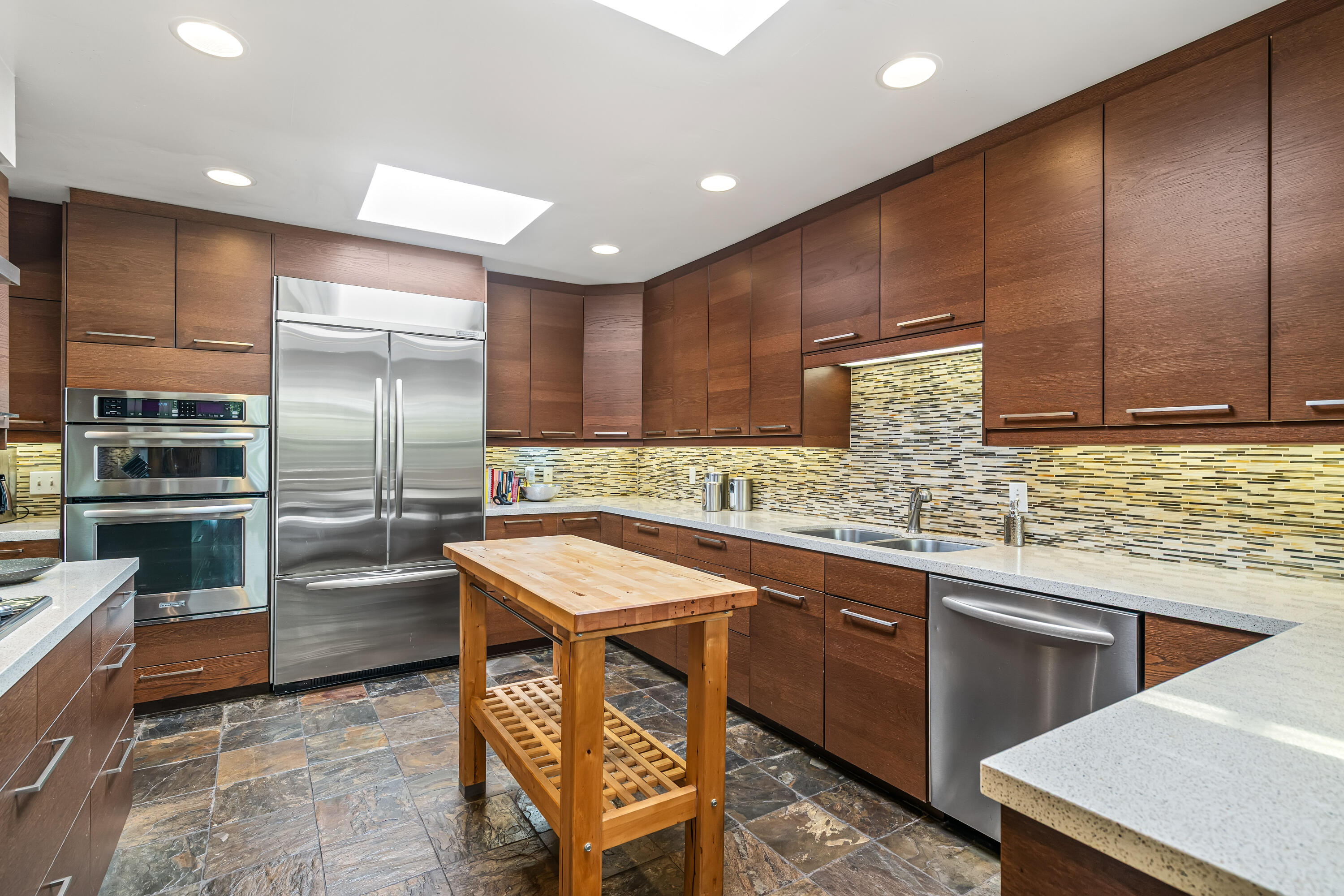 823 San Lucas Road Palm Springs, CA 92264 - Photo 22 of 71 a kitchen with stainless steel appliances a sink a stove a refrigerator and cabinets
