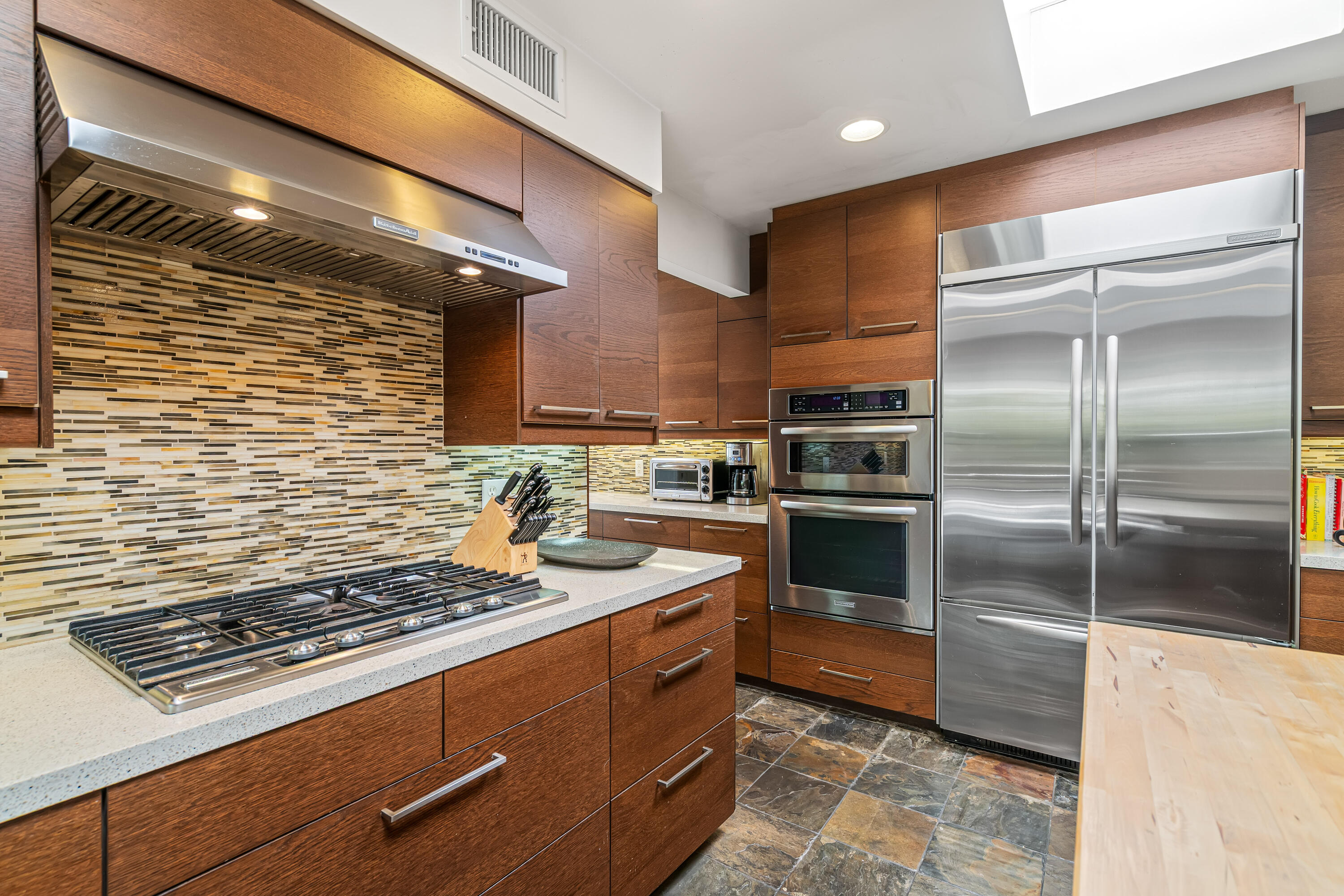 823 San Lucas Road Palm Springs, CA 92264 - Photo 23 of 71 a kitchen with sink cabinets and stainless steel appliances