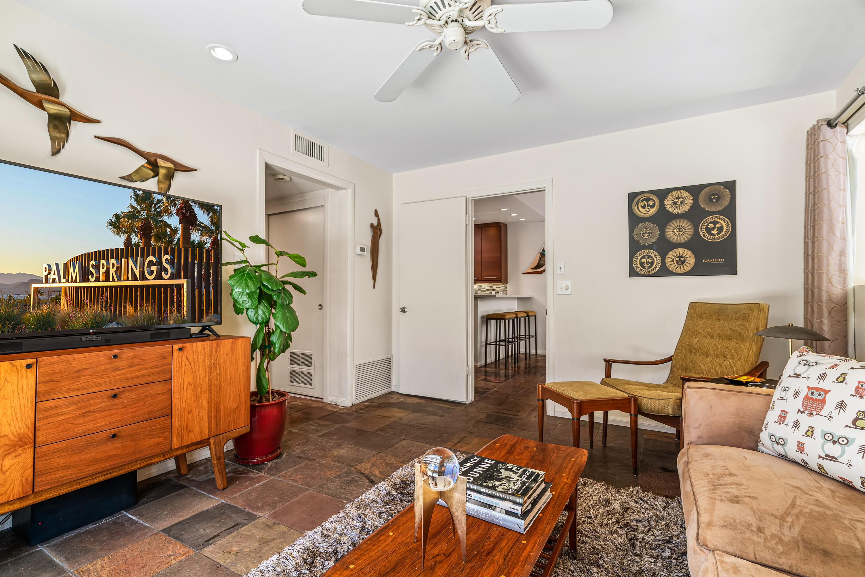 823 San Lucas Road Palm Springs, CA 92264 - Photo 26 of 71 a living room with furniture and wooden floor