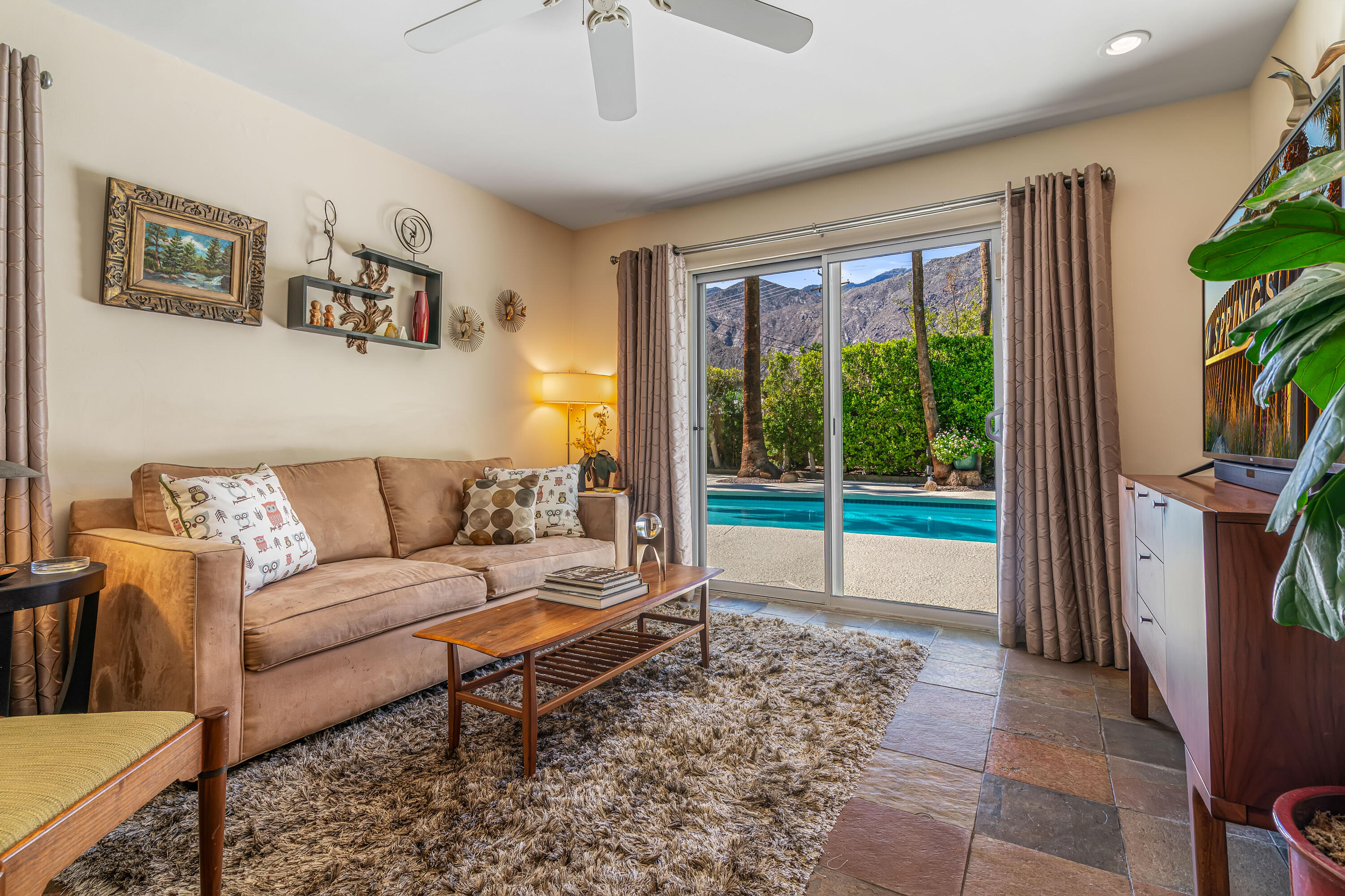 823 San Lucas Road Palm Springs, CA 92264 - Photo 28 of 71 a living room with furniture and a flat screen tv