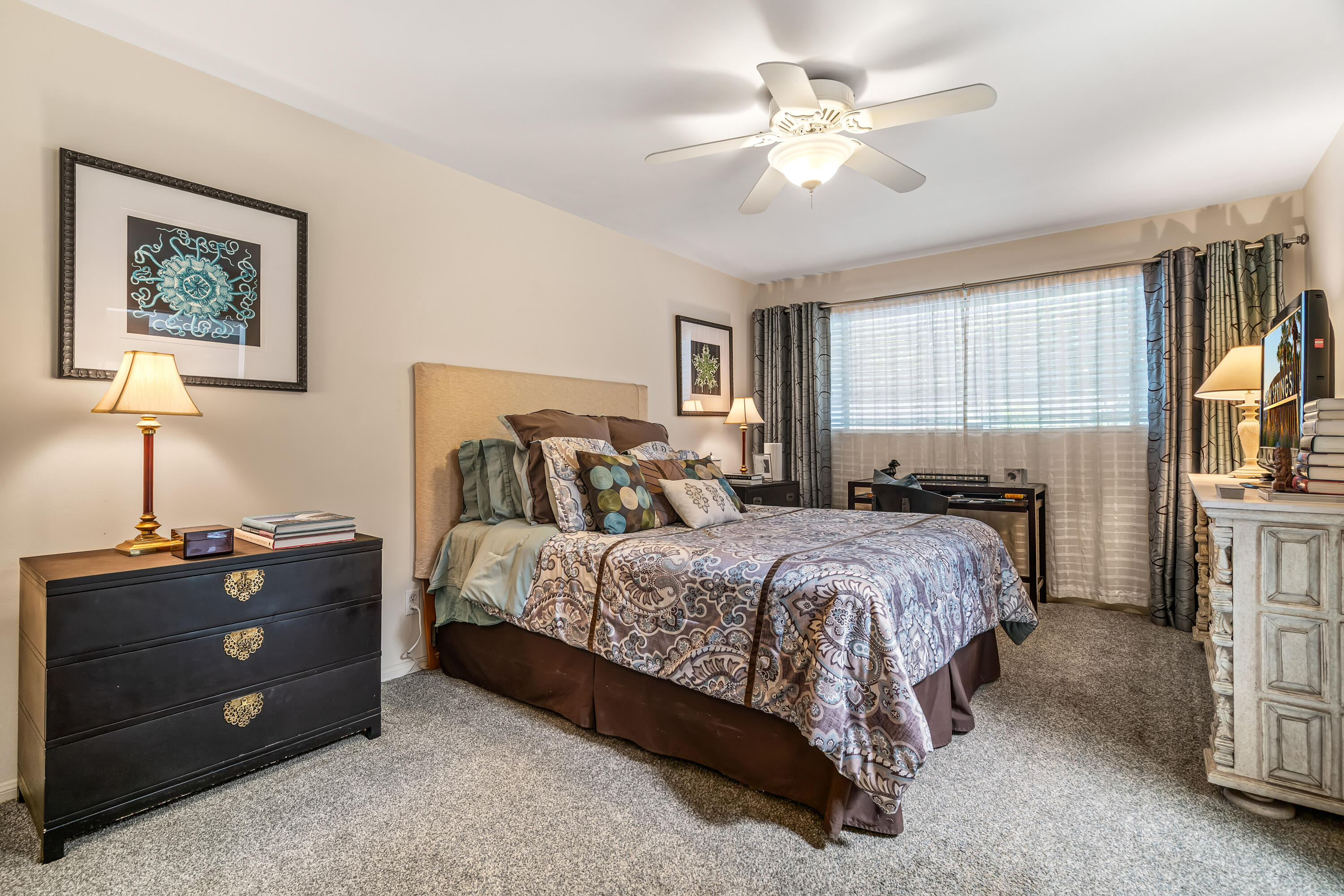 823 San Lucas Road Palm Springs, CA 92264 - Photo 31 of 71 a bedroom with a bed and a chandelier