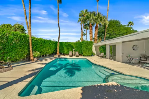 a outdoor space with lots of furniture and glass windows